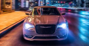 2019 Chrysler 300 driving along the city streets at night