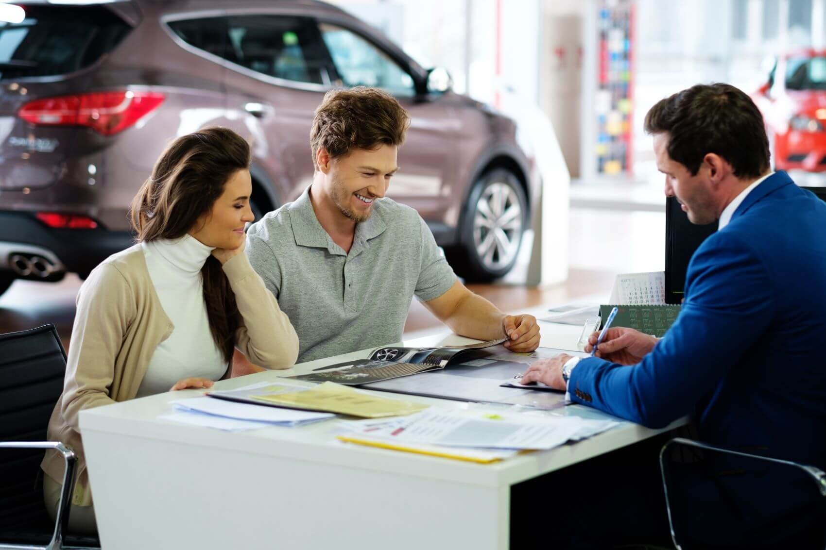Customers Sitting at Desk with Customers