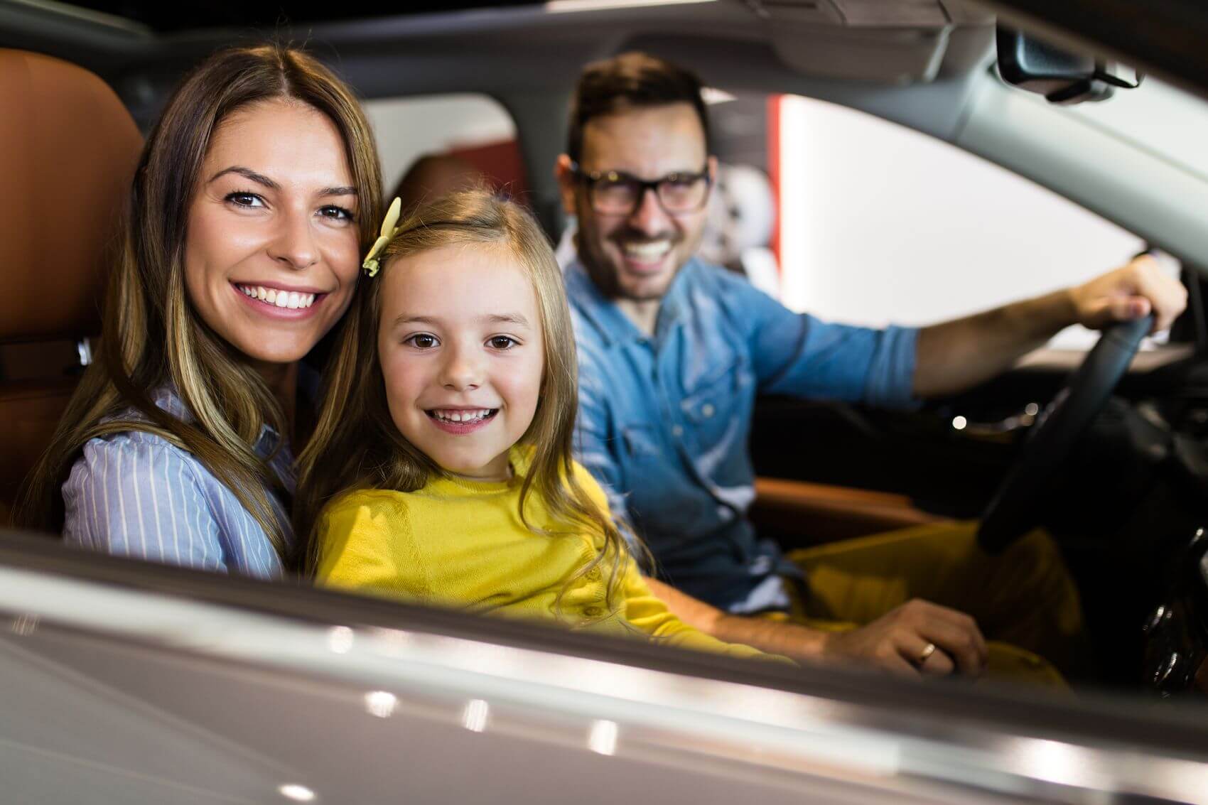 Happy family in car